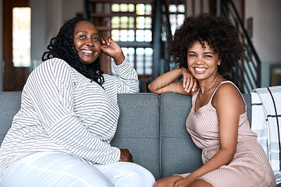 Buy stock photo Portrait of a happy young woman bonding and spending time with her mother at home