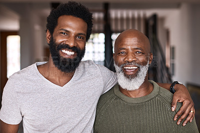 Buy stock photo Portrait of a happy young man relaxing and spending time with his father at home