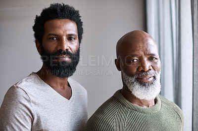 Buy stock photo Portrait of a handsome young man posing next to his father at home