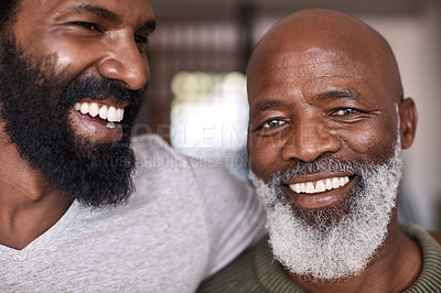 Buy stock photo Portrait of a happy senior man bonding and spending time with his adult son at home
