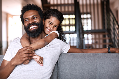 Buy stock photo Portrait of an adorable little girl bonding and spending time with her father at home