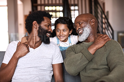 Buy stock photo Shot of an adorable little girl spending time with her father and grandfather at home