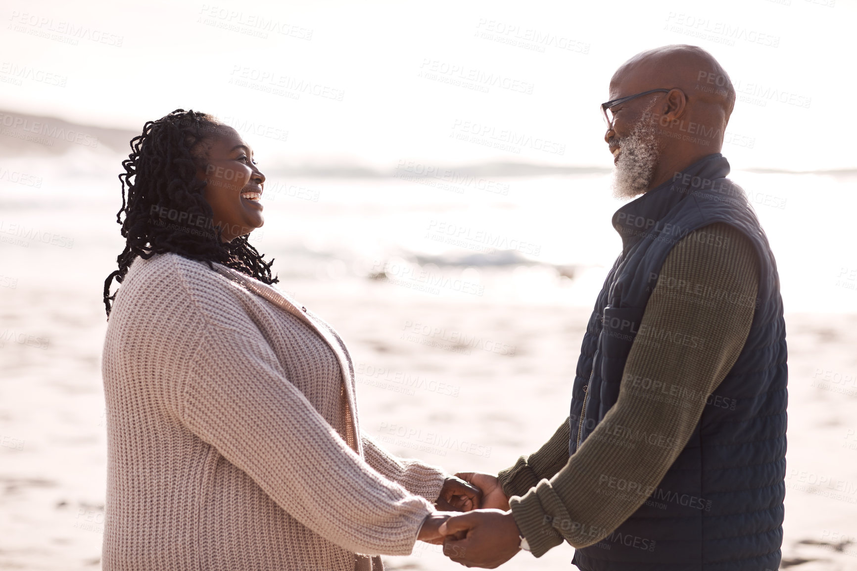 Buy stock photo Shot of a happy mature couple spending a romantic day at the beach