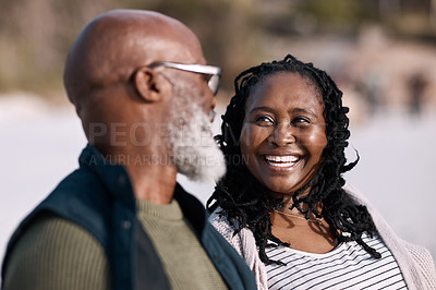 Buy stock photo Shot of a happy mature couple spending a romantic day at the beach