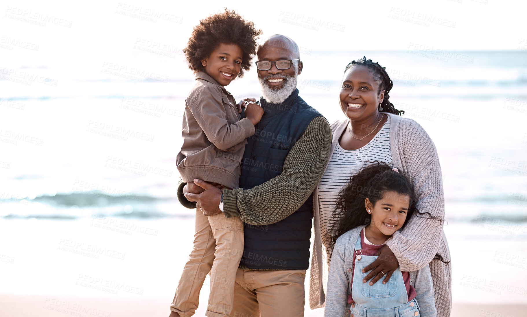 Buy stock photo Happy, grandparents and kids on beach for portrait, connection and relationship by ocean. Travel, generations and children with grandma, grandpa and smile for vacation, summer and weekend together