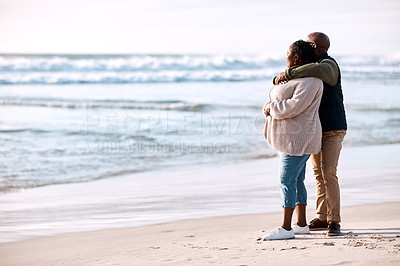 Buy stock photo Shot of a happy mature couple spending a romantic day at the beach