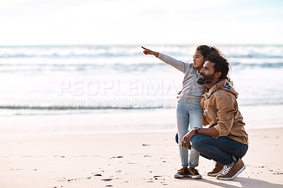 Buy stock photo Shot of an adorable little girl having a fun day at the beach with her father
