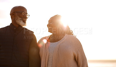 Buy stock photo Shot of a happy mature couple spending a romantic day at the beach