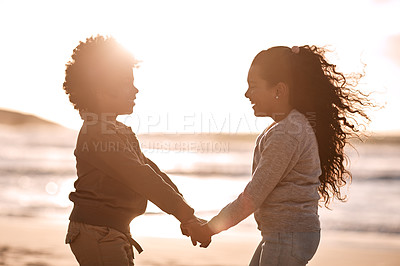 Buy stock photo Shot of an adorable little boy and girl having fun together at the beach