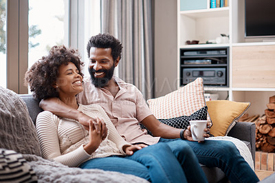 Buy stock photo Cropped shot of an affectionate couple relaxing on the sofa at home