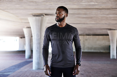Buy stock photo Cropped shot of a handsome young male athlete working out in the city