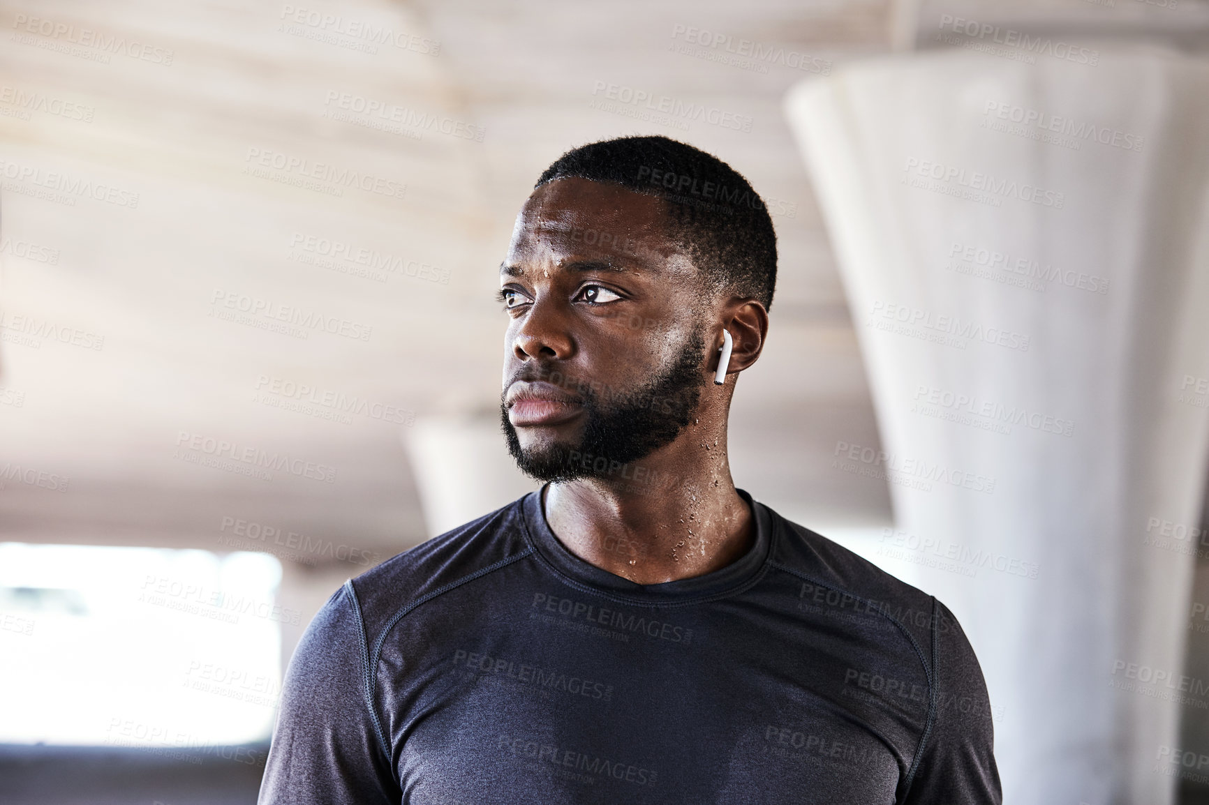 Buy stock photo Cropped shot of a handsome young male athlete working out in the city