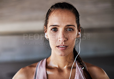 Buy stock photo Cropped portrait of an attractive young female athlete working out in the city