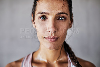 Buy stock photo Cropped portrait of an attractive young female athlete working out in the city
