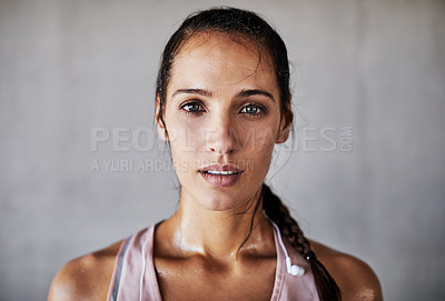 Buy stock photo Cropped portrait of an attractive young female athlete working out in the city