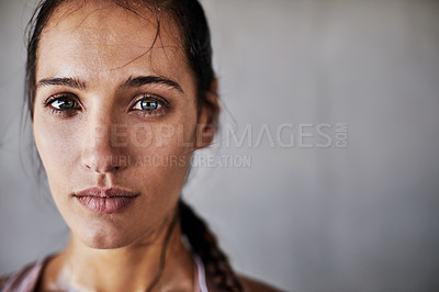 Buy stock photo Cropped portrait of an attractive young female athlete working out in the city