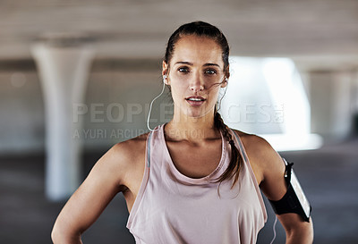 Buy stock photo Cropped portrait of an attractive young female athlete working out in the city
