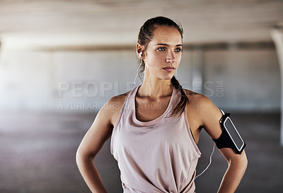 Buy stock photo Cropped shot of an attractive young female athlete working out in the city
