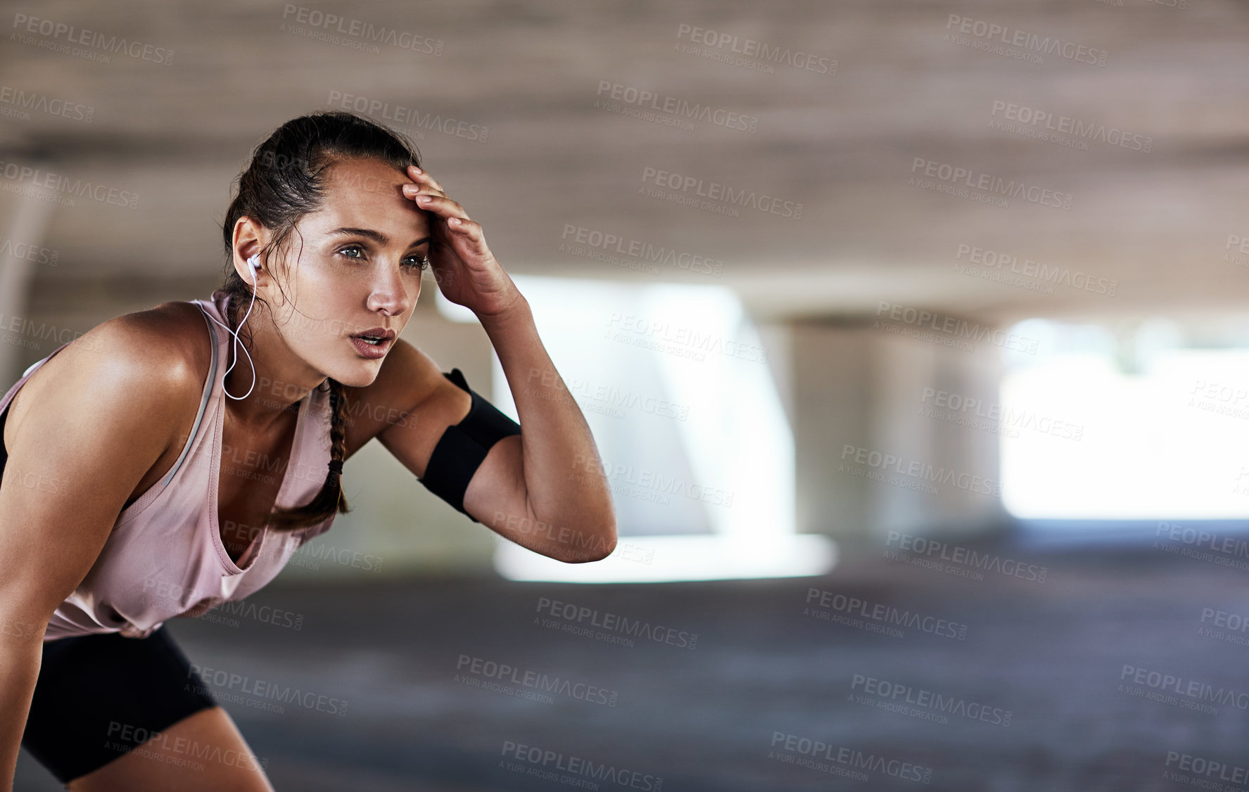 Buy stock photo Runner, exercise break and woman in city with fitness, tired or earphones for intense cardio routine. Sweat, fatigue and person with space for music, breathing or exhausted for endurance challenge