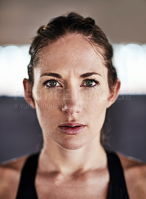Buy stock photo Cropped portrait of an attractive young female athlete working out in the city