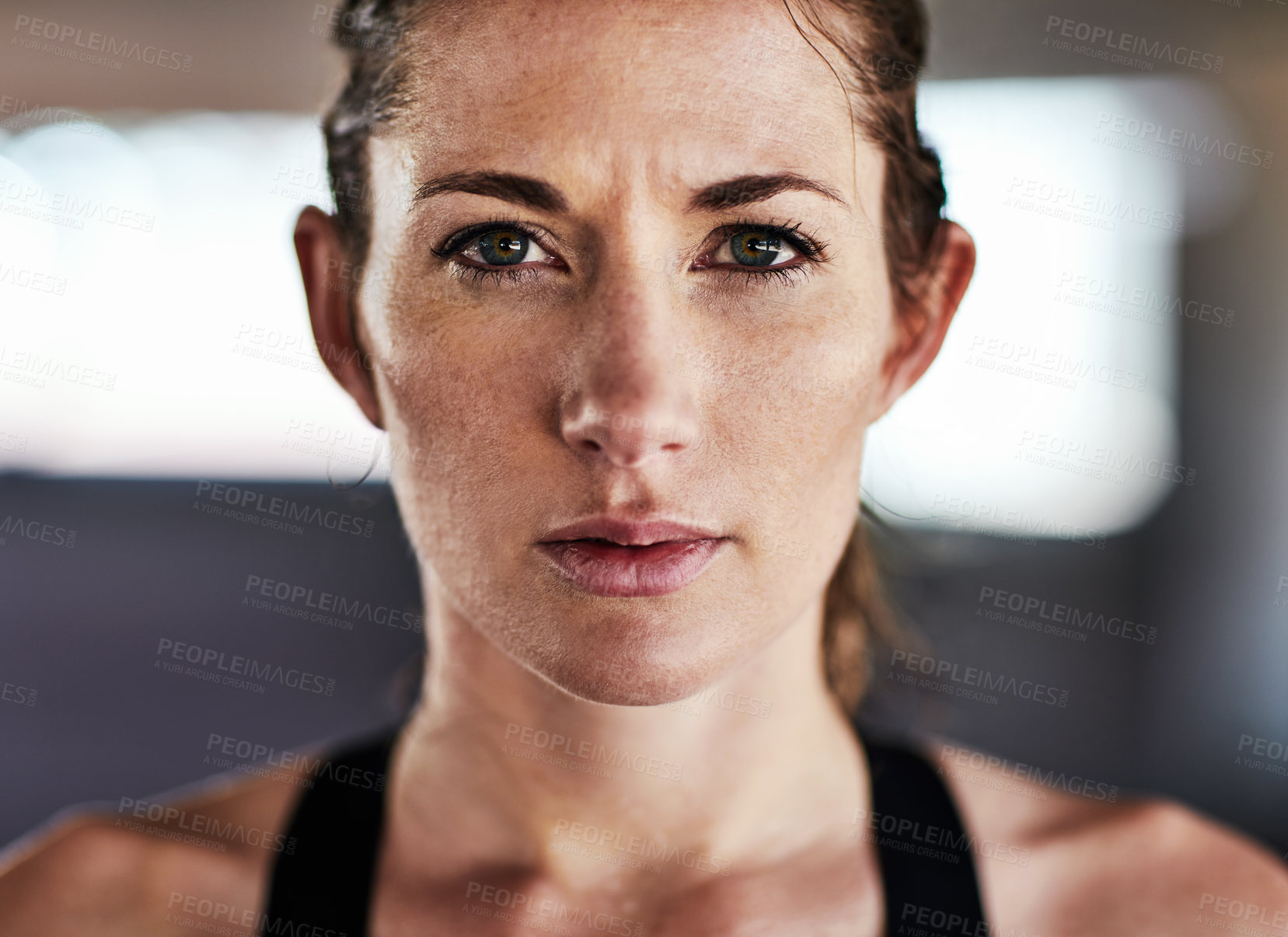 Buy stock photo Cropped portrait of an attractive young female athlete working out in the city