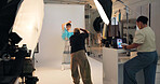 Photoshoot, camera and people in studio, photographer and laptop for creative project. Group, man and women in workplace, backstage and equipment for magazine catalog, artist and production process