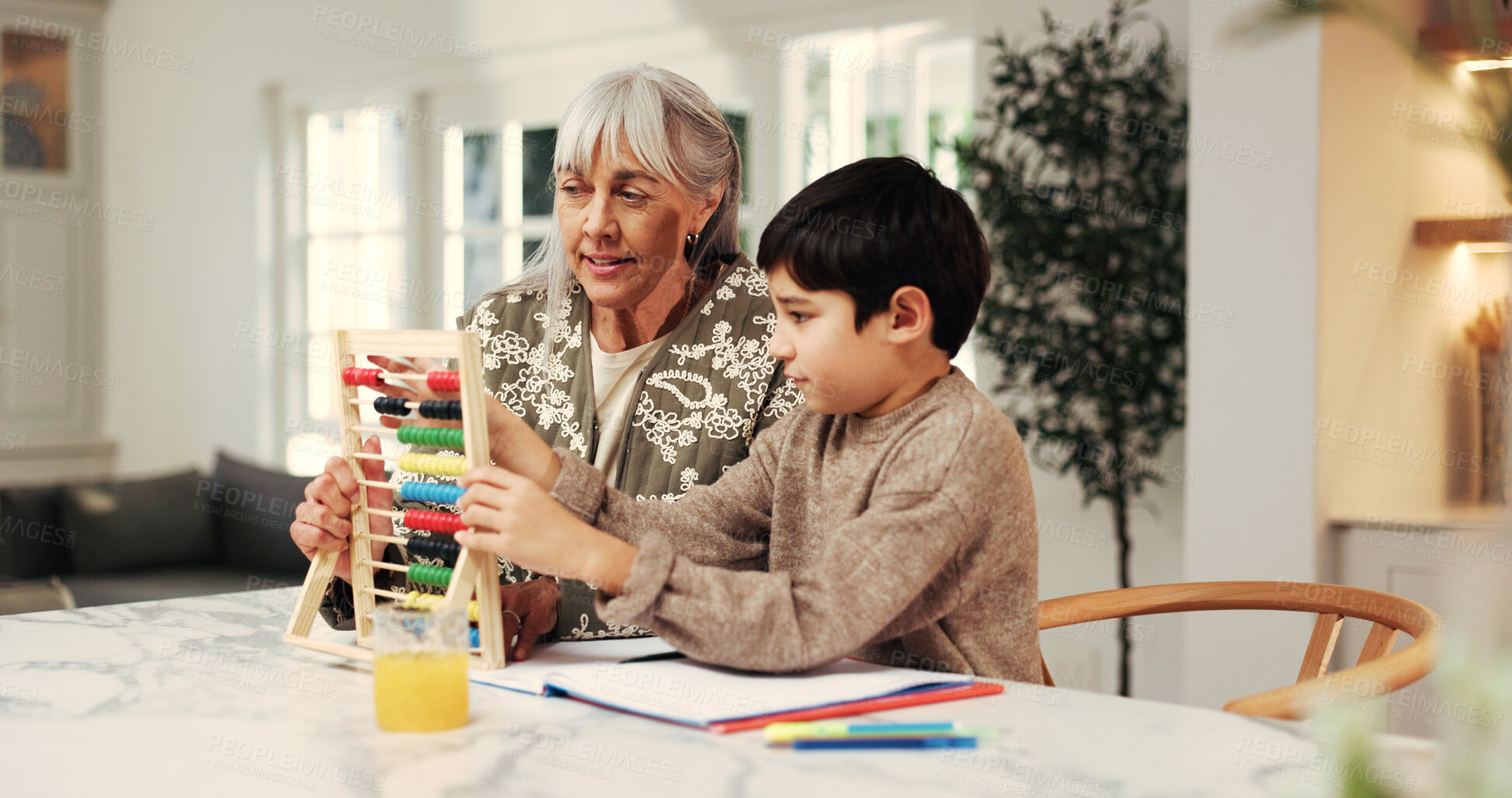 Buy stock photo Support, grandmother or boy in home with abacus, math practice or bead counting in homework. Education, child or senior woman with help, literacy activity or cognitive development in homeschool.
