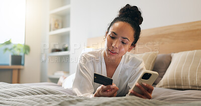 Buy stock photo Credit card, phone and woman in bedroom for online shopping, ecommerce or purchase on mobile app. Debit, cellphone and person on bed for order on retail website with internet banking in home.