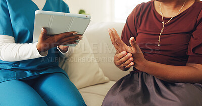 Buy stock photo Nurse, consultation and patient hands with arthritis, help and tablet for medical research in home. People, healthcare worker and appointment in house with tech, joint pain and disease diagnosis.