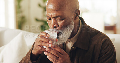 Buy stock photo Drinking water, black man and hydration in home for wellness, detox and liquid in lounge. Elderly person, glass and fluid for digestion, thirst and nutrition in house with electrolytes for retirement