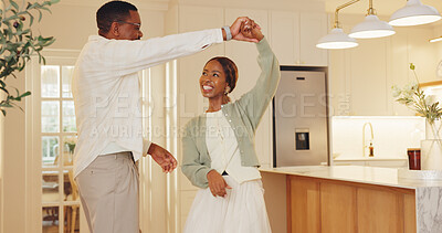 Buy stock photo Dancing, happy and couple in kitchen at house with music for bonding, love and connection together. Smile, marriage and black man with woman for moving to romantic playlist on weekend in apartment.