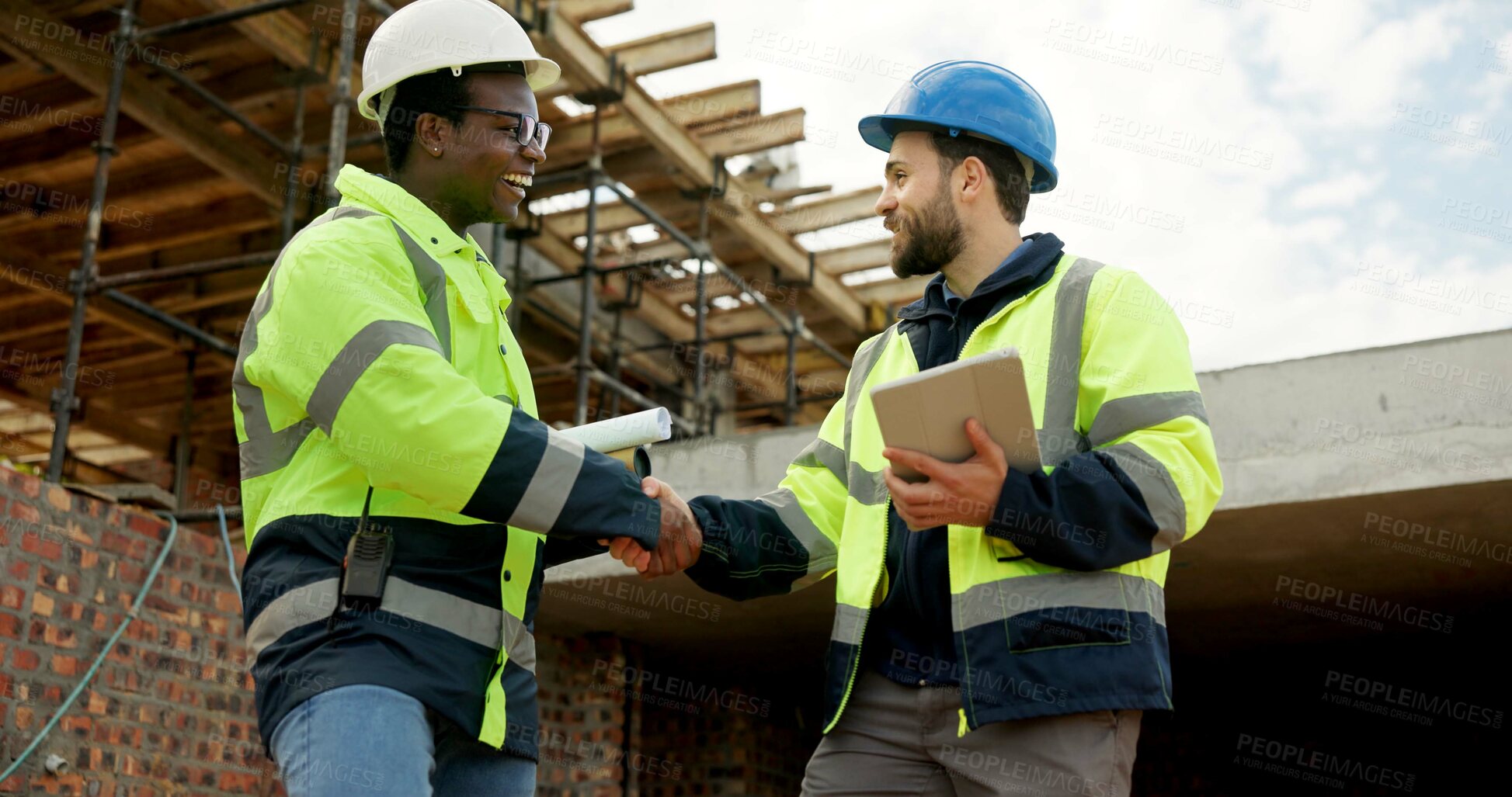 Buy stock photo Architect, handshake and men with tablet, outdoor and agreement for building project or achievement. Happy people, shaking hands and team with tech on construction site, low angle and real estate