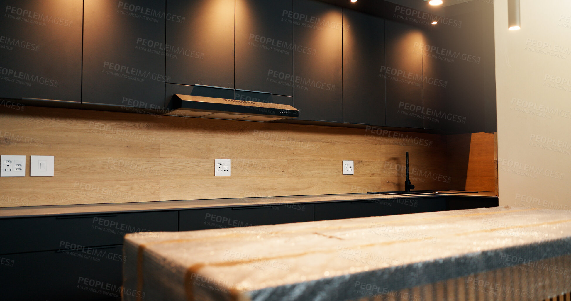 Buy stock photo Empty, room and kitchen renovation with cabinetry for modern finish, property upgrade or lighting. Interior design, remodeling project and cover for fitted furniture, refurbishment and house makeover