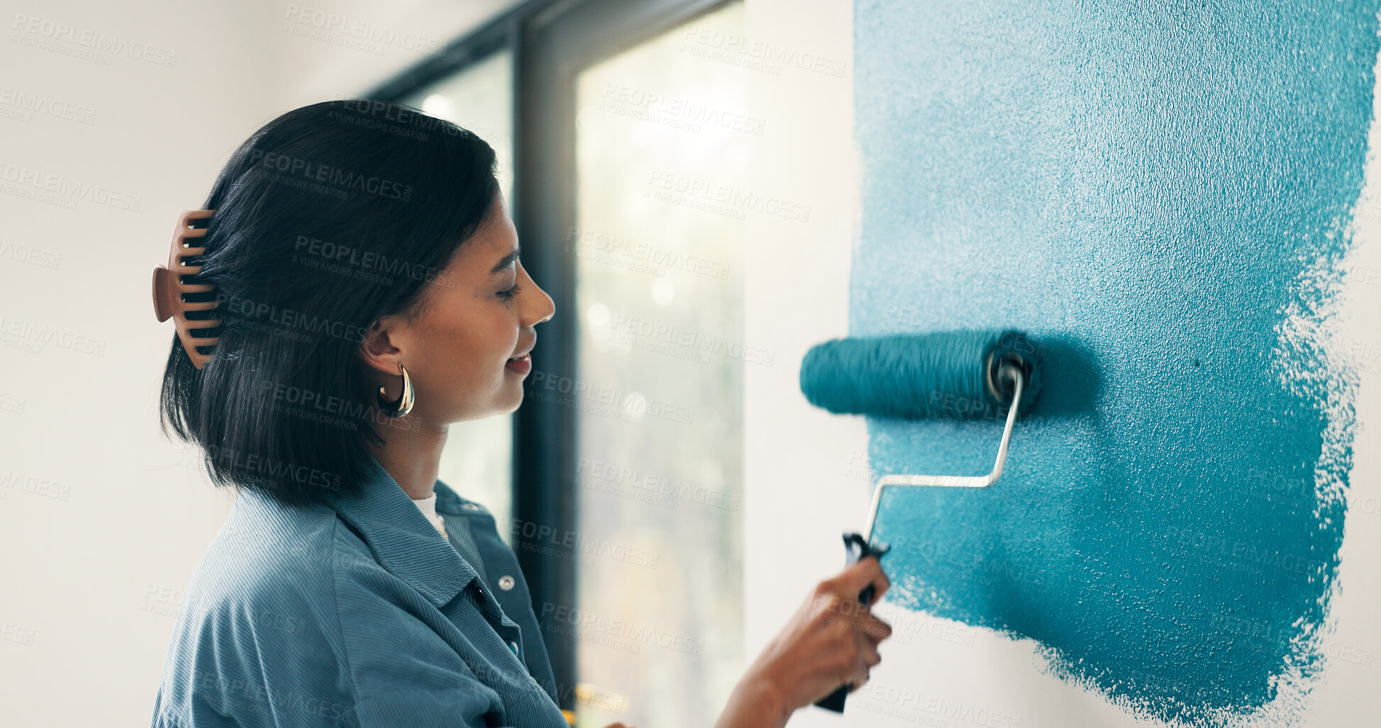 Buy stock photo Painting, woman and smile with wall renovation for living room makeover, home upgrade or maintenance. Interior design, homeowner and happy with paintbrush for house improvement, change and diy decor