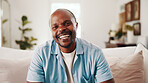 Portrait, black man and relax at house with smile, peace and comfortable for weekend break on sofa. Happy, male person and rest in lounge with positive attitude, laughing and calm morning to unwind
