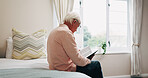 Senior, man or reading on bed with bible for faith, religion or holy knowledge in retirement home. Elderly, male person or book with scripture in bedroom for christianity, belief or worship in house