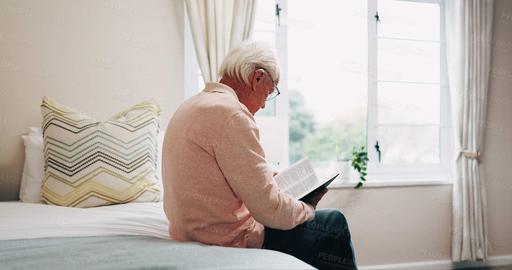 Buy stock photo Senior, man or reading on bed with bible for faith, religion or holy knowledge in retirement home. Elderly, male person or book with scripture in bedroom for christianity, belief or worship in house