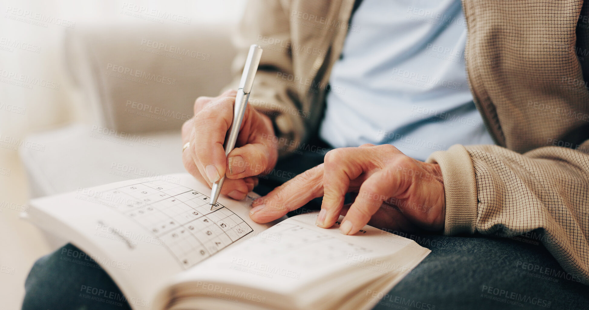 Buy stock photo Senior, hands and writing with book for sudoku, number puzzle or thinking game in retirement home. Elderly, male person or cognitive activity with blank blocks for problem solving or skill in house