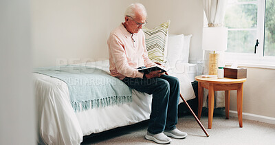 Buy stock photo Senior, man and reading with bible in home for religion, belief or holy study in retirement. Elderly, male person or pensioner with book of god for faith, spiritual wellness or connection in bedroom