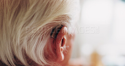 Buy stock photo Elderly, person and hearing aid with space in home, auditory support and help in retirement. Deaf, ear or cochlear implant for pensioner with disability, healthcare and technology in senior housing