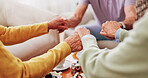 Empathy, holding hands and prayer with old people in retirement home together for belief or faith. Praying, religion and support with senior friends in apartment for bonding, christianity or praise
