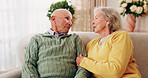 Elderly, couple and conversation in retirement home with support, bonding together and connection. Married, senior people and discussion in living room with love, soulmate relationship and loyalty.