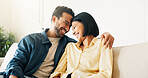 Smile, relax and couple on sofa in home with bonding, love and connection in marriage on weekend. Forehead touch, trust and man embracing woman in living room for commitment, care and affection.
