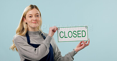 Buy stock photo Closed, sulking and portrait of woman as cafe owner in studio for failure, announcement or signage. Sad, disappointed and message for bankruptcy, store or waitress with poster on blue background