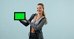 Green screen, fitness and portrait of woman with tablet in studio for gym membership sign up. Happy, mockup space and sports coach with digital technology for online news on app on blue background.