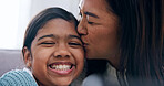 Smile, mother and child at house with kiss, love and parental affection for bonding together. Portrait, woman and daughter in home for appreciation, connection and childcare for weekend break on sofa