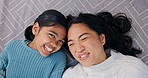Above, mother and child at house with smile, love and parental admiration for bonding together. Portrait, woman and laugh on carpet with daughter, connection and childcare for weekend break in lounge