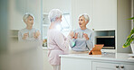 Conversation, coffee break and senior friends in kitchen for bonding, reunion gossip and catch up in home. Retirement, chat and elderly women with warm beverage for weekend visit, support and relax