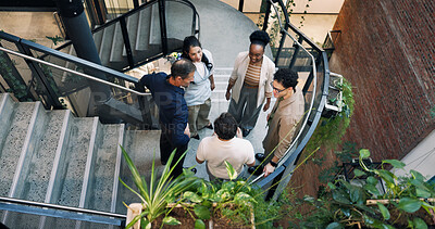 Buy stock photo Above, meeting and staircase with business people in office together for creative discussion. Collaboration, conversation and planning with designer team on steps in workplace for feedback or ideas