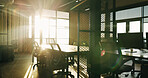 Background, business and flare with empty office in morning for corporate or professional career. Chairs, space and table in room of workplace interior for company development, growth or sunshine
